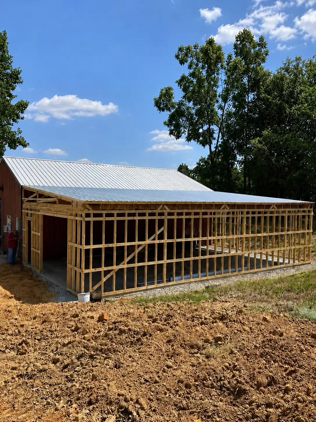 Post-frame pole barn with a metal roof under construction by Rust & Sawdust in Somerset, KY