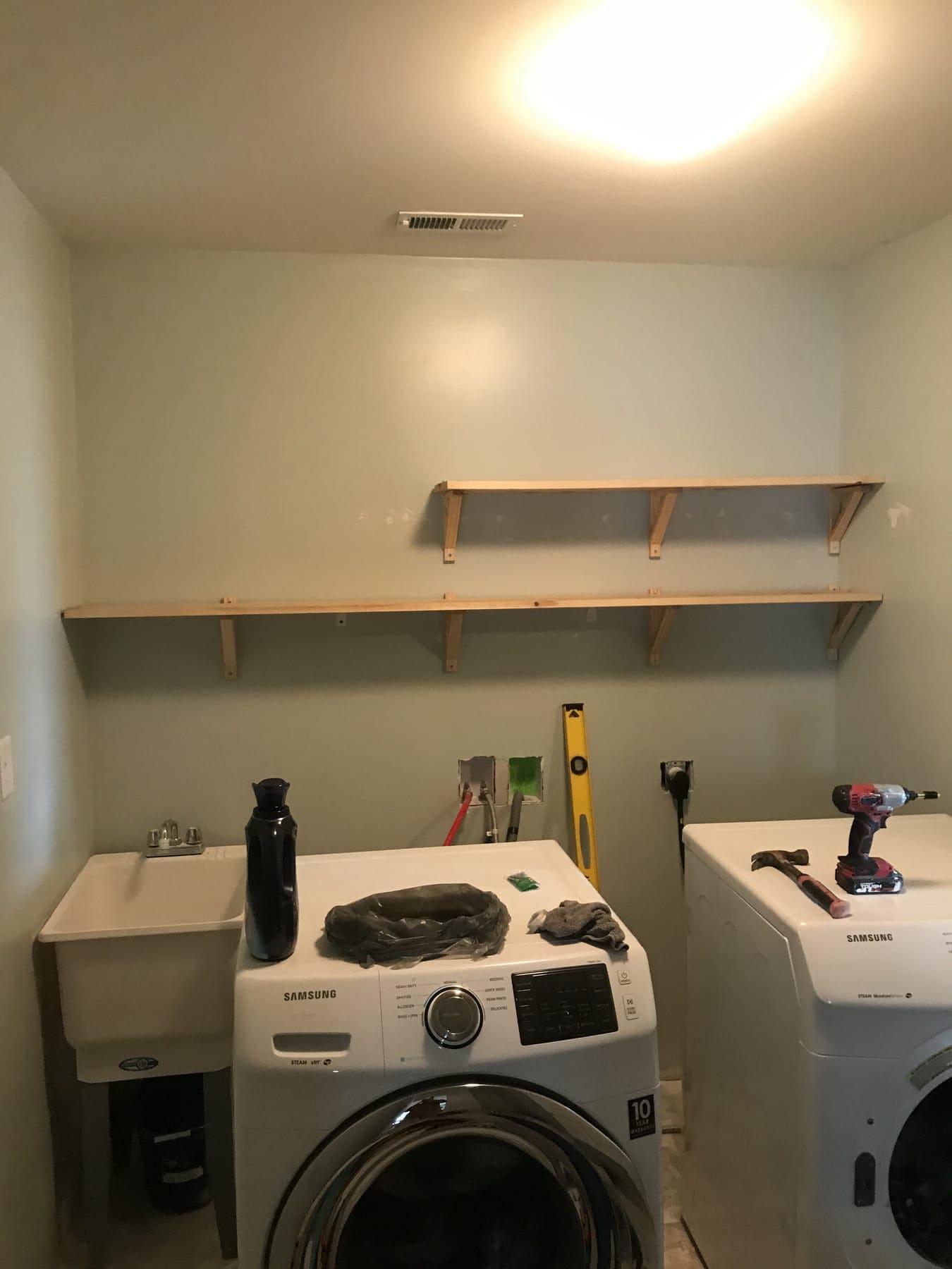 Built-in white shelving Built-in white shelving for a laundry room in a Kentucky home.